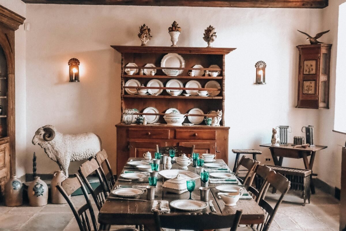 Rustic dining room with a wooden table, chairs and a dresser