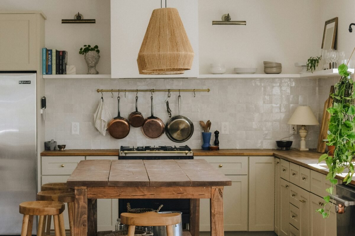 Rustic kitchen with a wooden island and bar stools